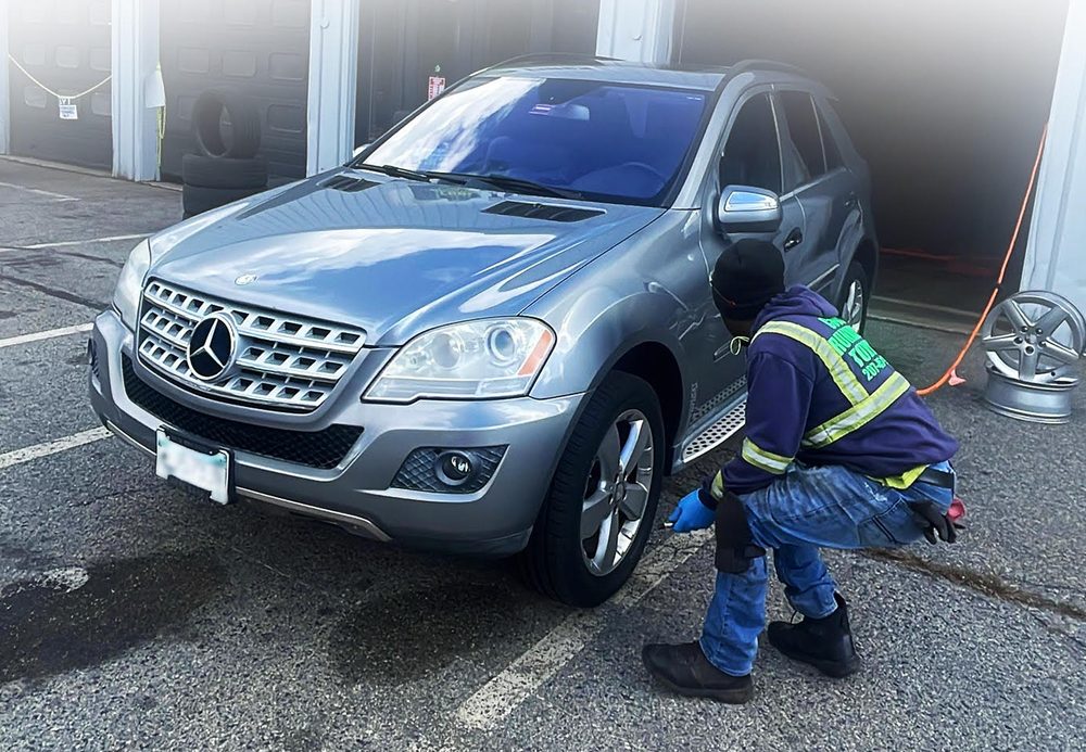 Technician servicing a vehicle at Cool Runnings